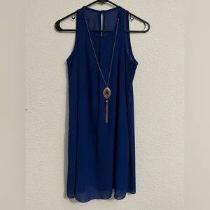 Blue medium length dress with high collar and necklace attached